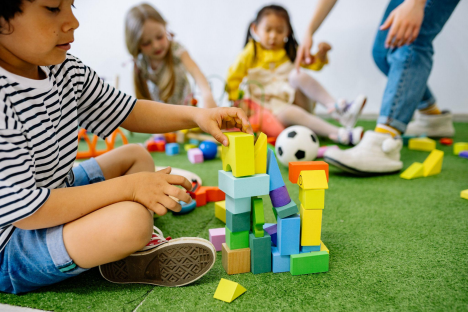 children playing with blocks in a playroom